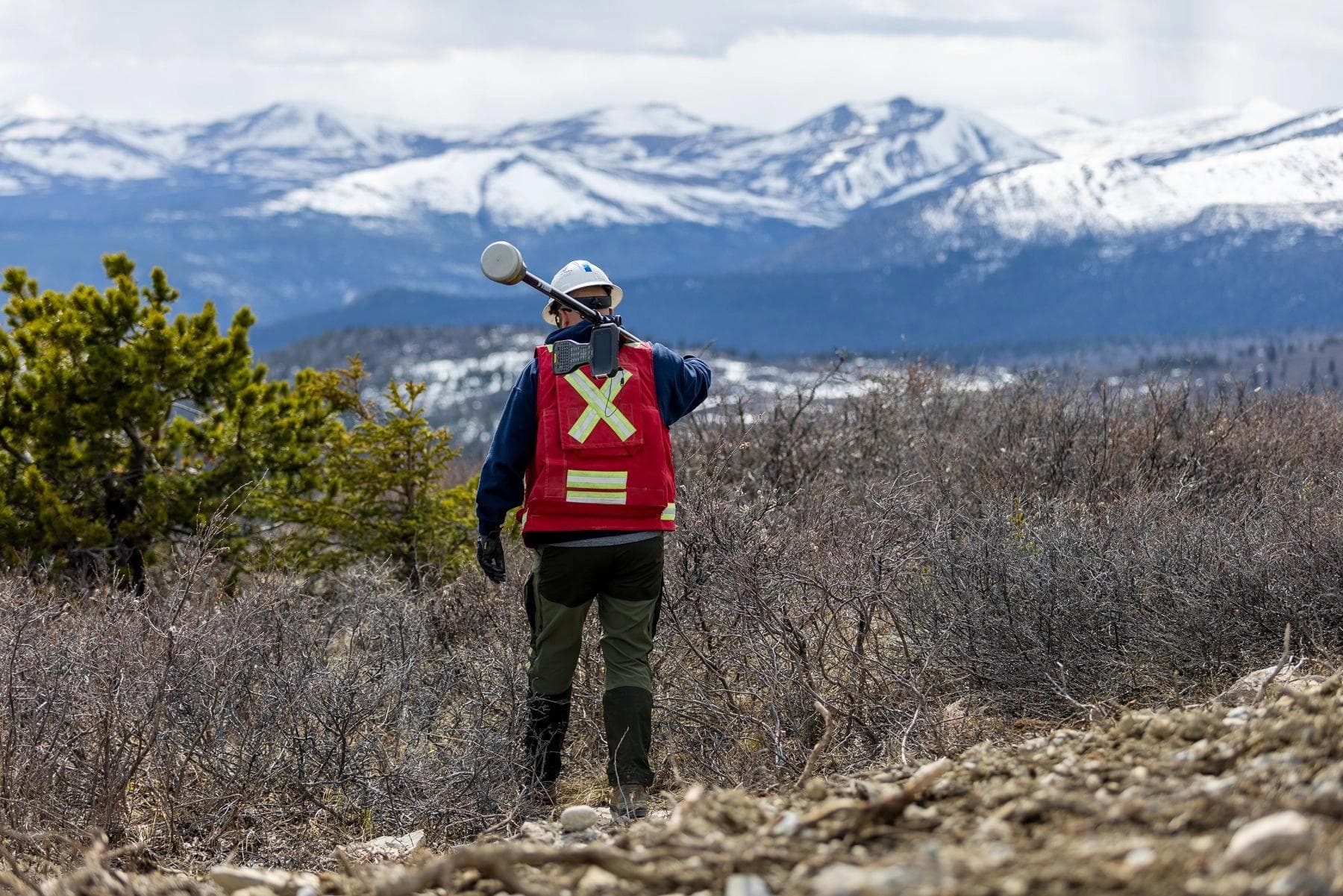 An Underhill surveyor looking out at a vast Yukon landscape.