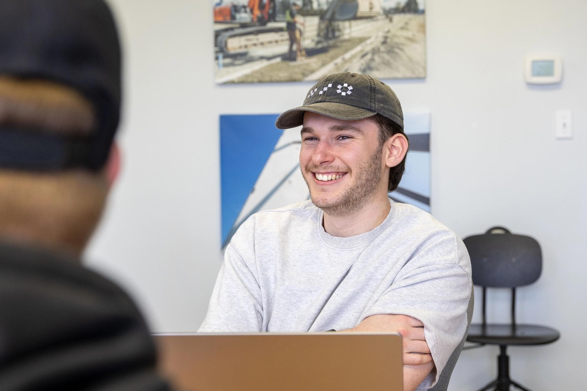 One of Site's videographers wearing a Site-branded hat.