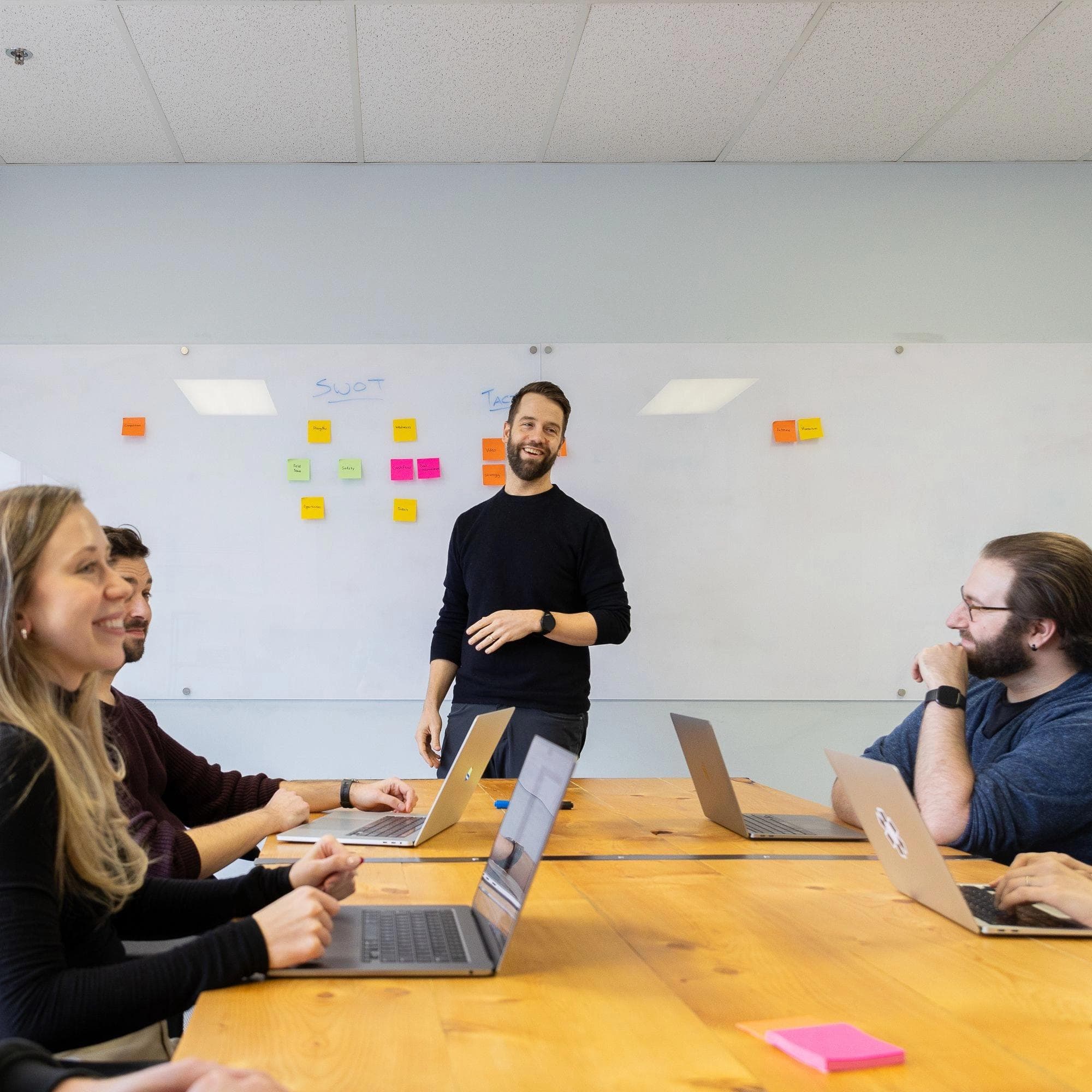 Site team members collaborating in a boardroom