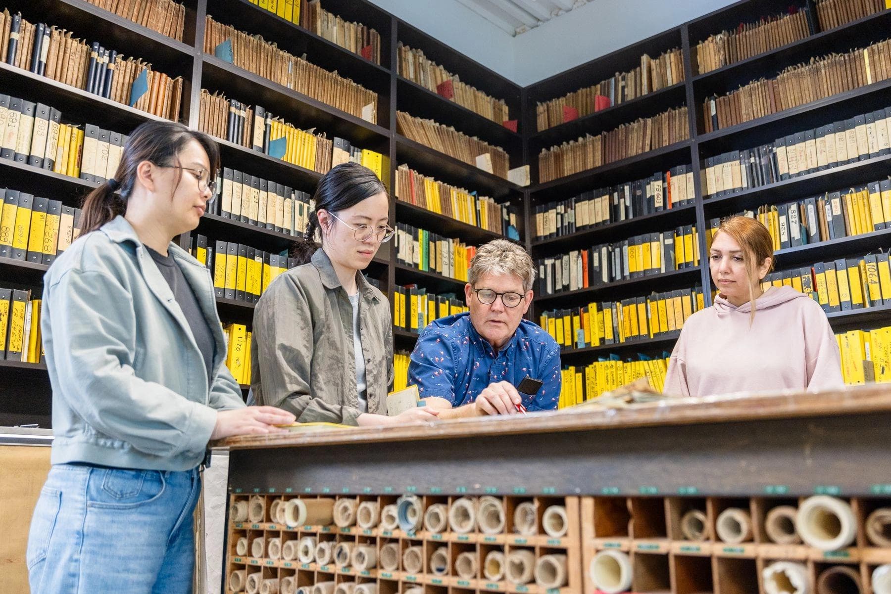 Underhill employees in one of their large archives.