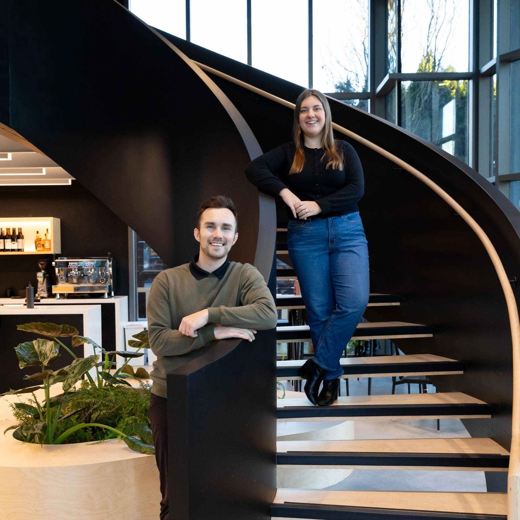 Jadon and Micheyla on the main staircase at Site HQ