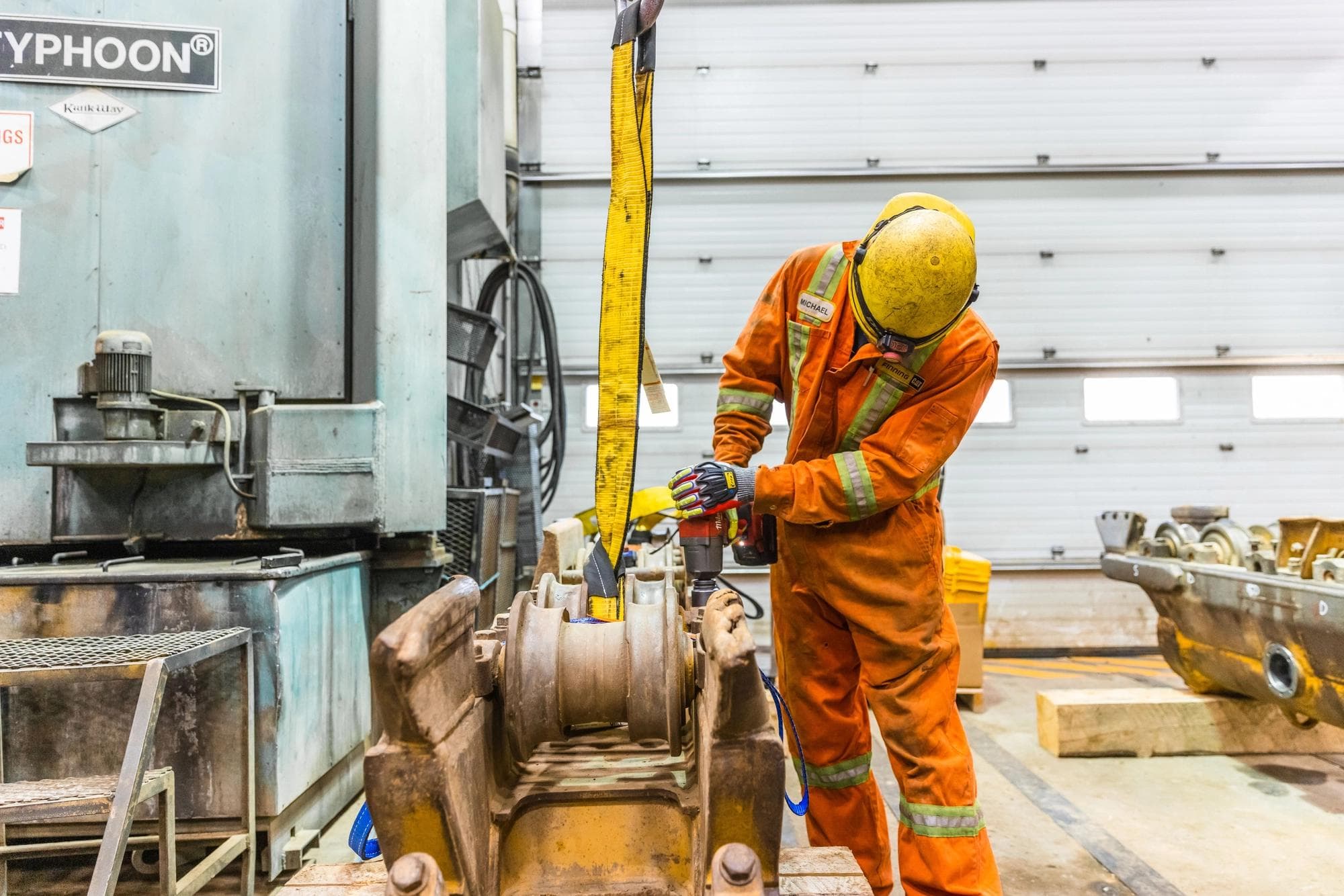A Finning technician working on heavy machinery.